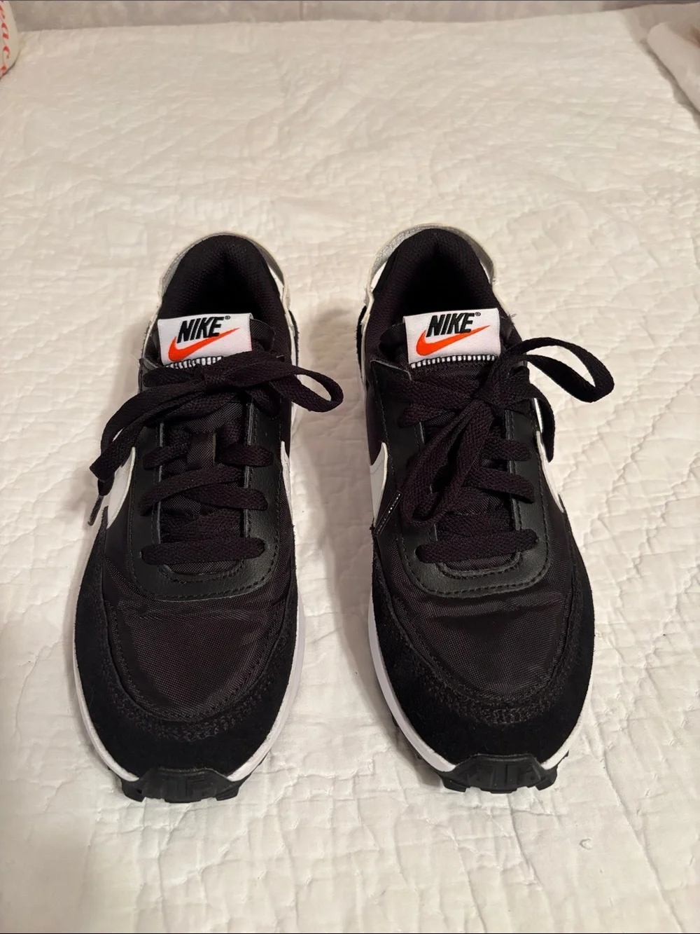 Nike Black Low-Top Sneakers with‎ White Swoosh and Orange Logo